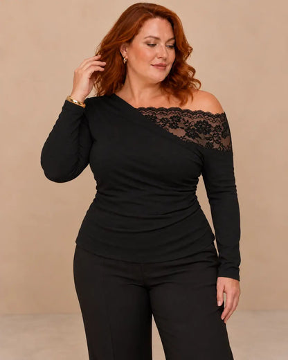 Camiseta mujer encaje floral asimétrico con escote asimétrico y mangas largas, ideal para ocasiones elegantes.