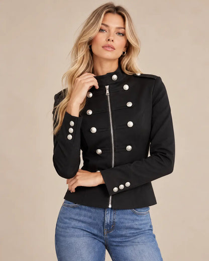 Chaqueta Cashia Céfiro negra talla S, con cremallera central, botones plateados y detalles militares.