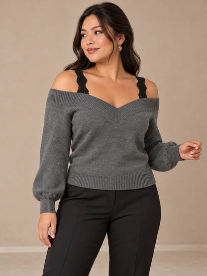 Jersey Cashia Arolla gris, talla L, en medio plano superior sobre modelo asiática con pelo suelto y pantalón negro de vestir.
