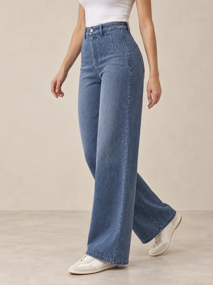 Pantalón Cashia Denim 401 denim medio, talla S, medio plano inferior sobre modelo, con tiro alto y pernera ancha.