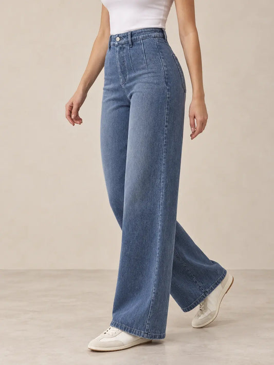 Pantalón Cashia Denim 401 denim medio, talla S, medio plano inferior sobre modelo, con tiro alto y pernera ancha.