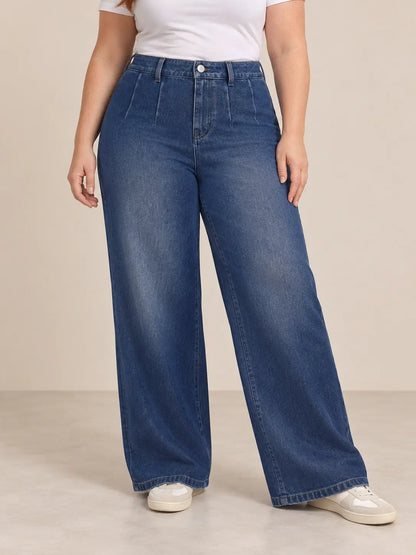 Pantalón Cashia Denim 401 denim oscuro, talla XL, medio plano inferior sobre modelo, con tiro alto y pernera ancha.