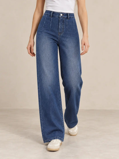 Pantalón Cashia Denim 401 denim oscuro, talla XS, medio plano inferior sobre modelo, con tiro alto y pernera ancha