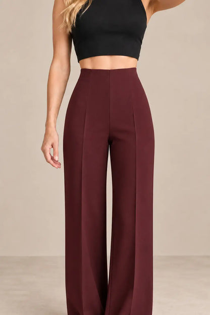 Pantalón de mujer tiro alto pierna amplia modelo en color burdeos, ideal para un look moderno y chic.
