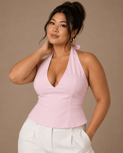 Top Cashia Treviso rosa en talla L, medio plano superior, escote halter pronunciado y modelo Cashia L con pelo recogido en alto.